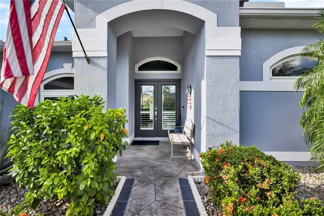 a front view of a house with garden