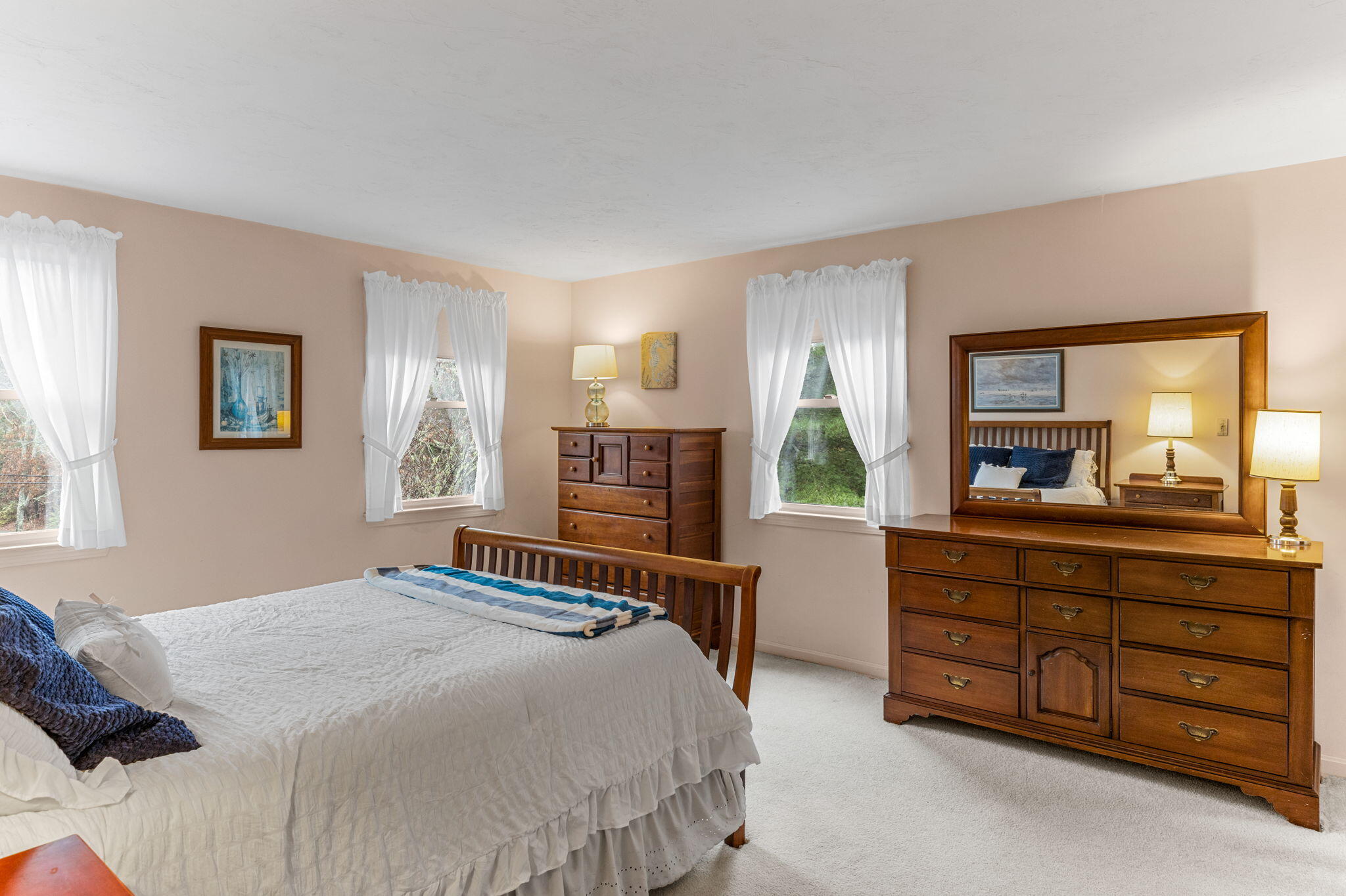 93 Valley Bars Road Buzzards Bay, MA 02532 - Photo 15 of 34 a bedroom with a bed and a large mirror on dresser