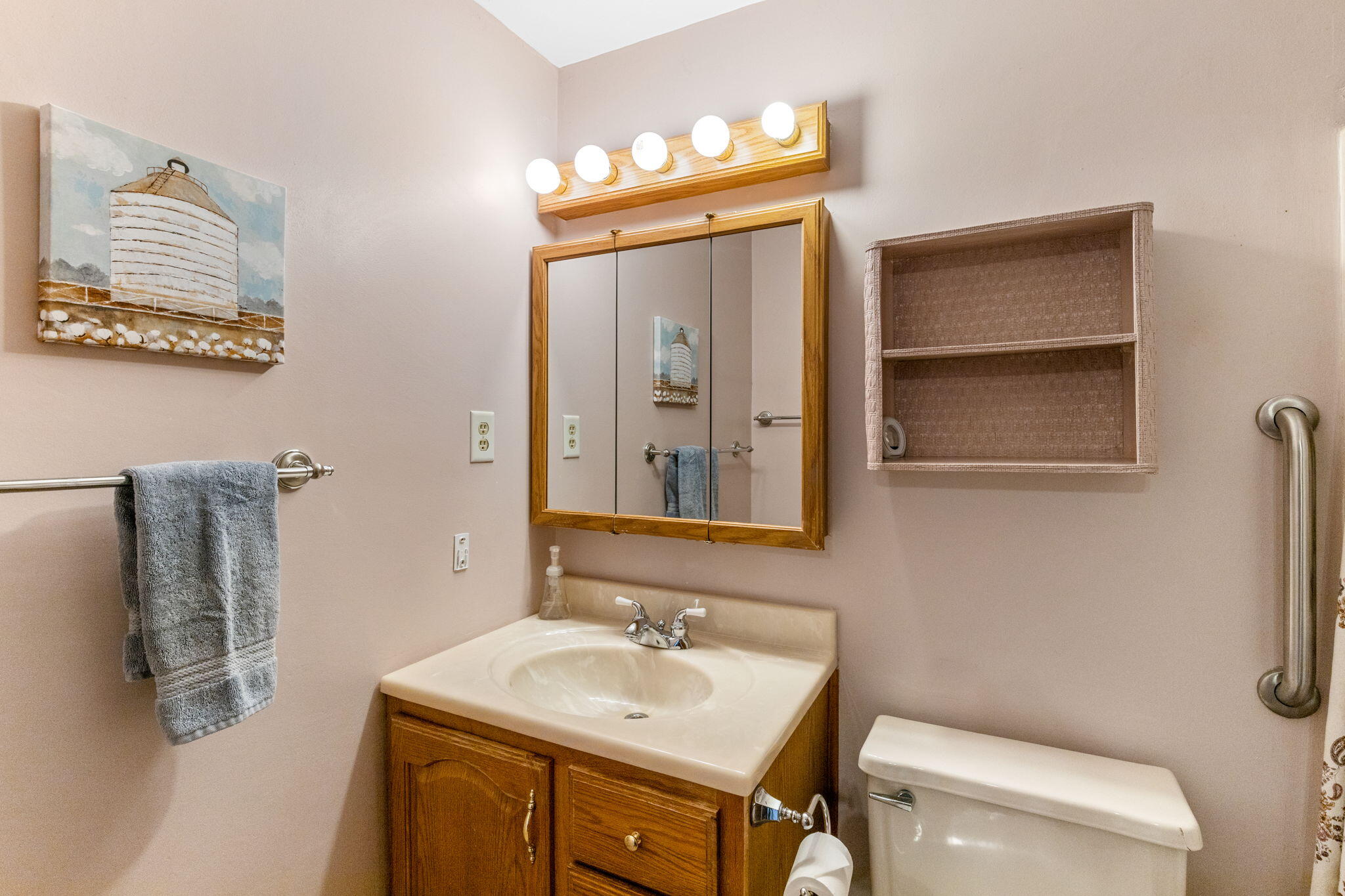 93 Valley Bars Road Buzzards Bay, MA 02532 - Photo 17 of 34 a bathroom with a sink a toilet and mirror