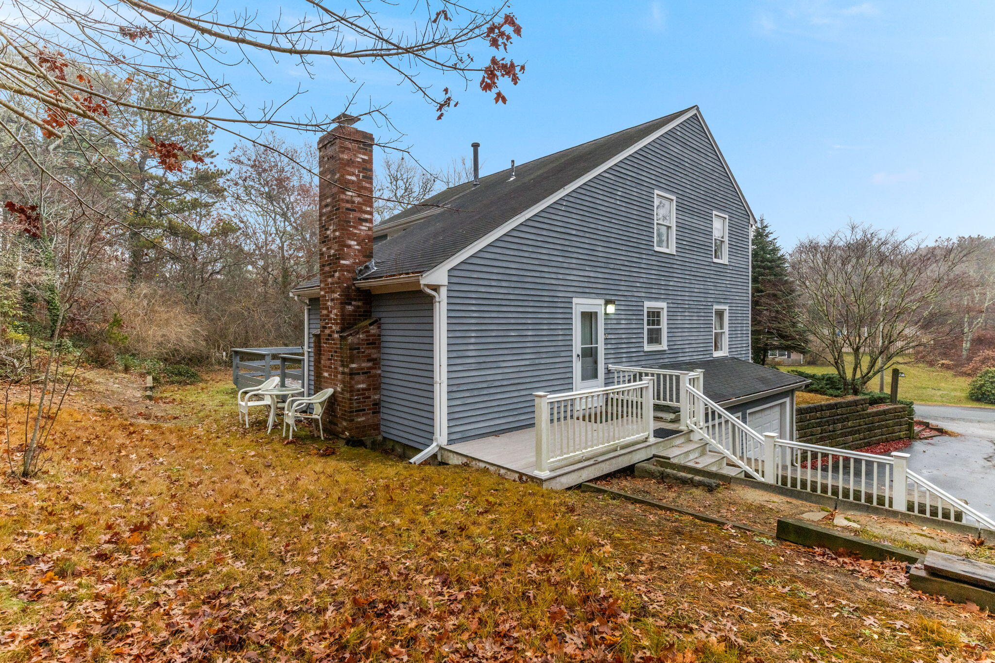 93 Valley Bars Road Buzzards Bay, MA 02532 - Photo 25 of 34 a view of a house with a yard and wooden fence
