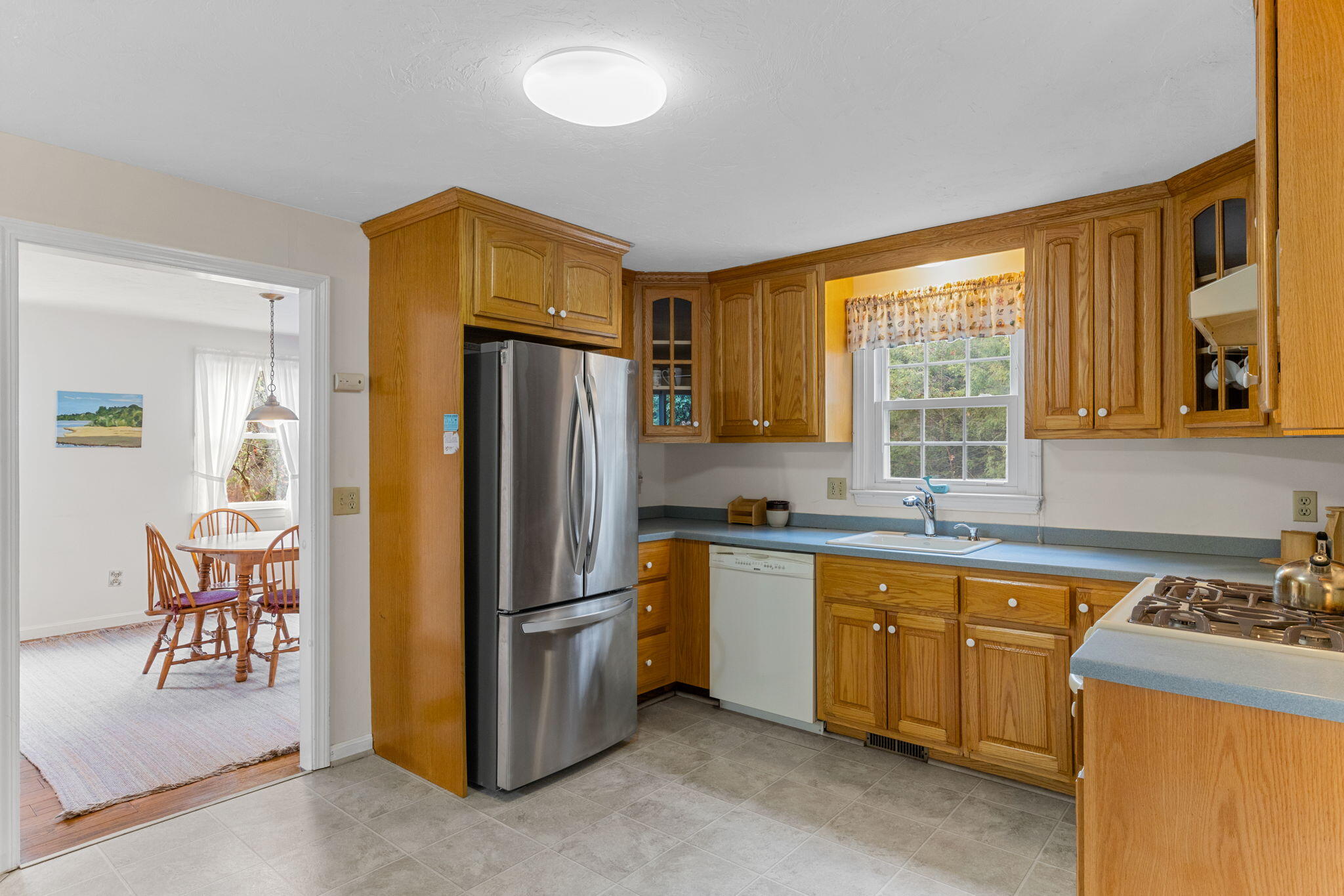 93 Valley Bars Road Buzzards Bay, MA 02532 - Photo 4 of 34 a kitchen that has a refrigerator and a sink