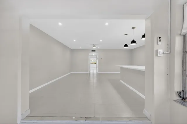 a view of an empty room with a bathroom