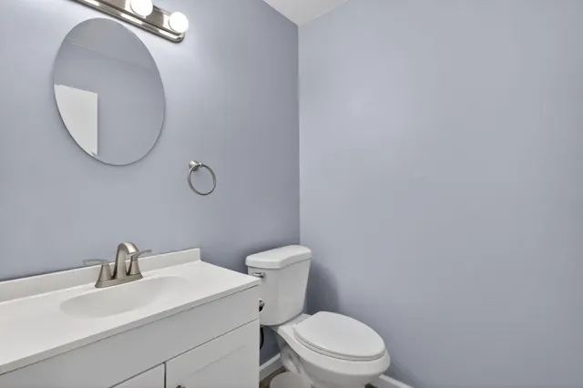 a bathroom with 2 sink and a mirror