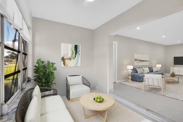 a living room with furniture and a potted plant