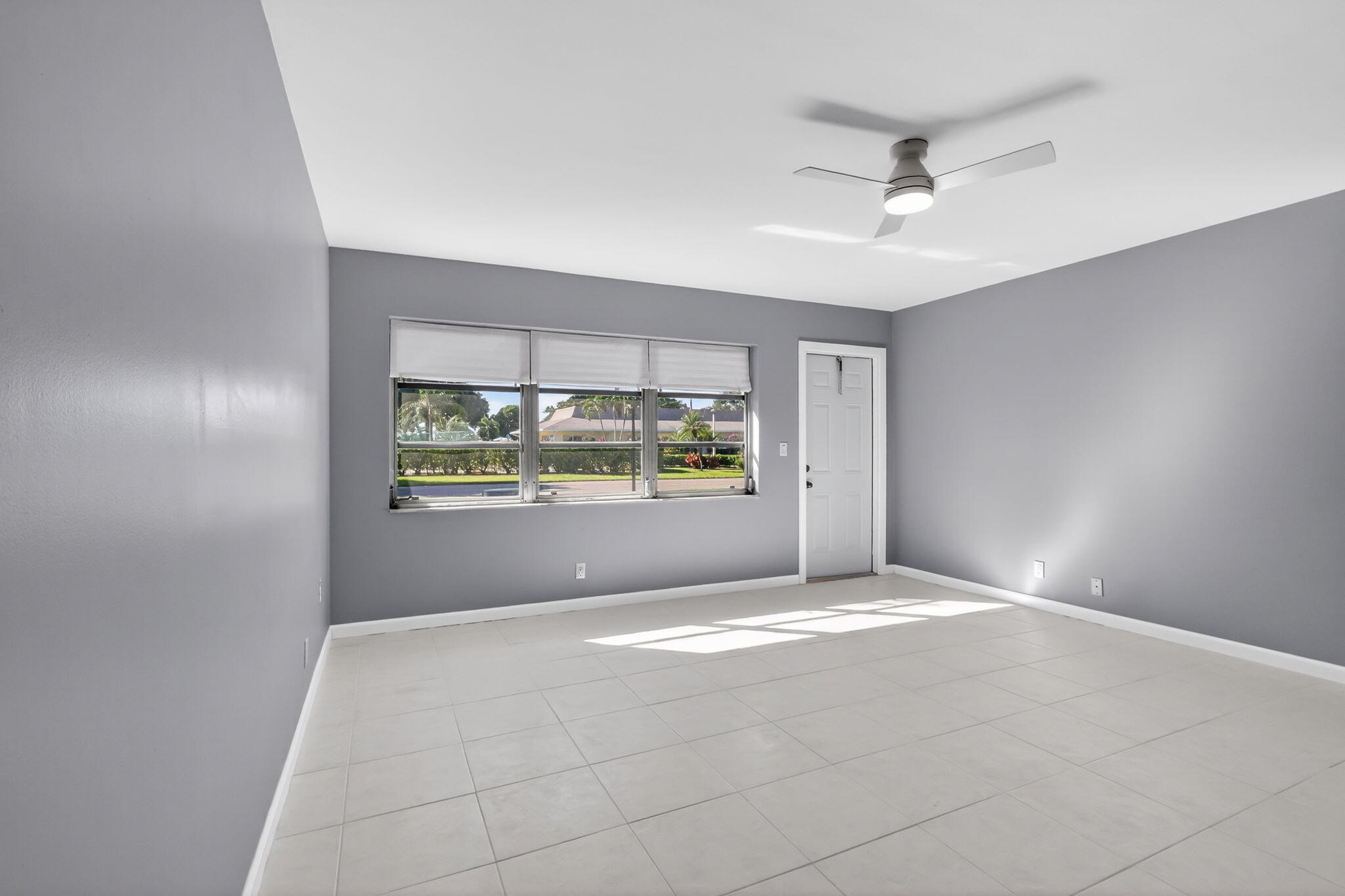 14280 Nesting Way, Unit B Delray Beach, FL 33484 - Photo 7 of 43 a view of an empty room with a window