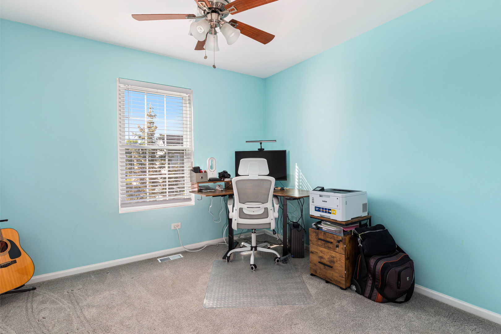 5003 Syracuse Court Plainfield, IL 60586 - Photo 15 of 18 a view of a workspace with furniture and a window