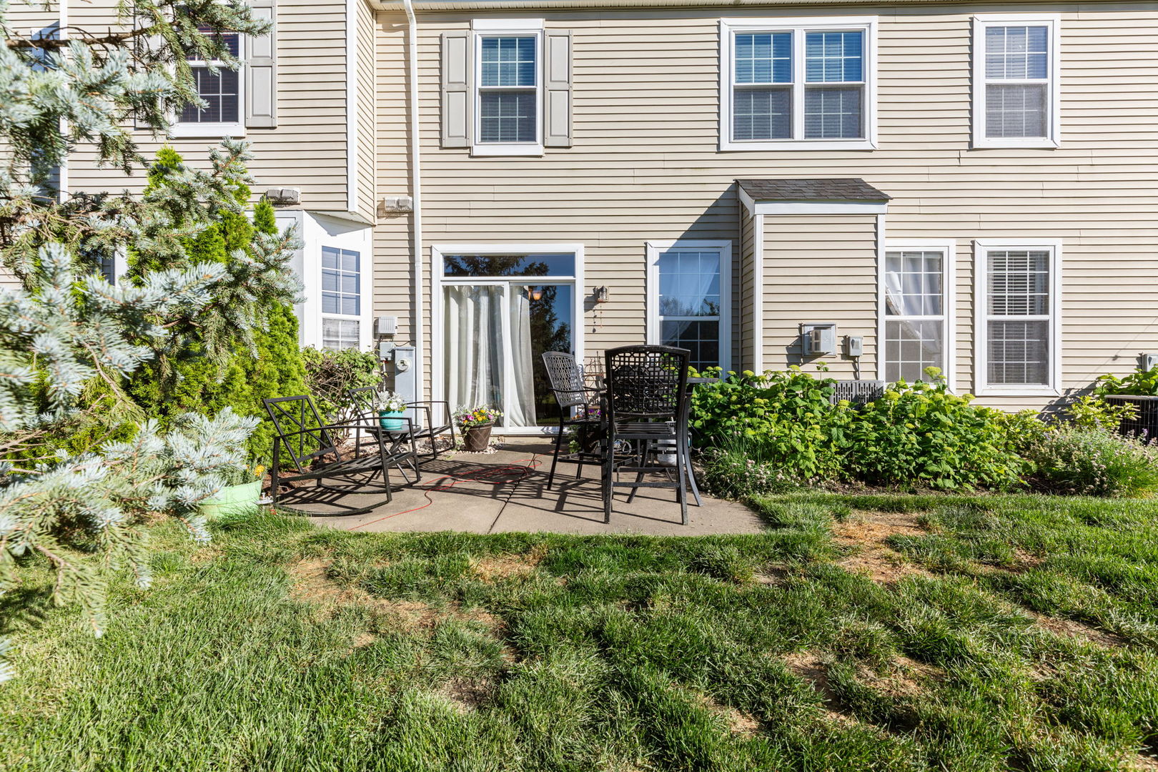 5003 Syracuse Court Plainfield, IL 60586 - Photo 18 of 18 a view of a chair and table in the back yard of a house