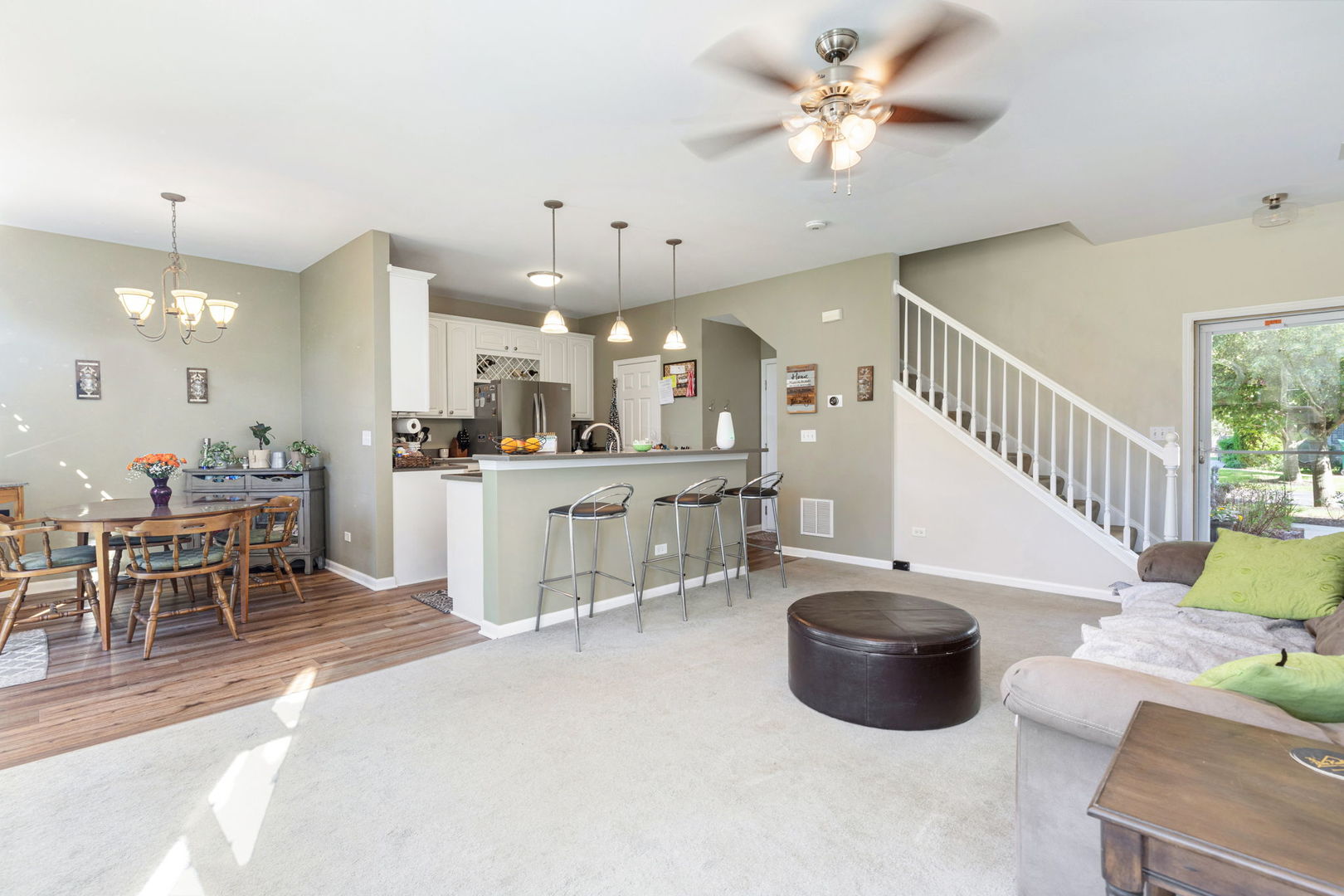 5003 Syracuse Court Plainfield, IL 60586 - Photo 6 of 18 a living room with furniture a table and chairs