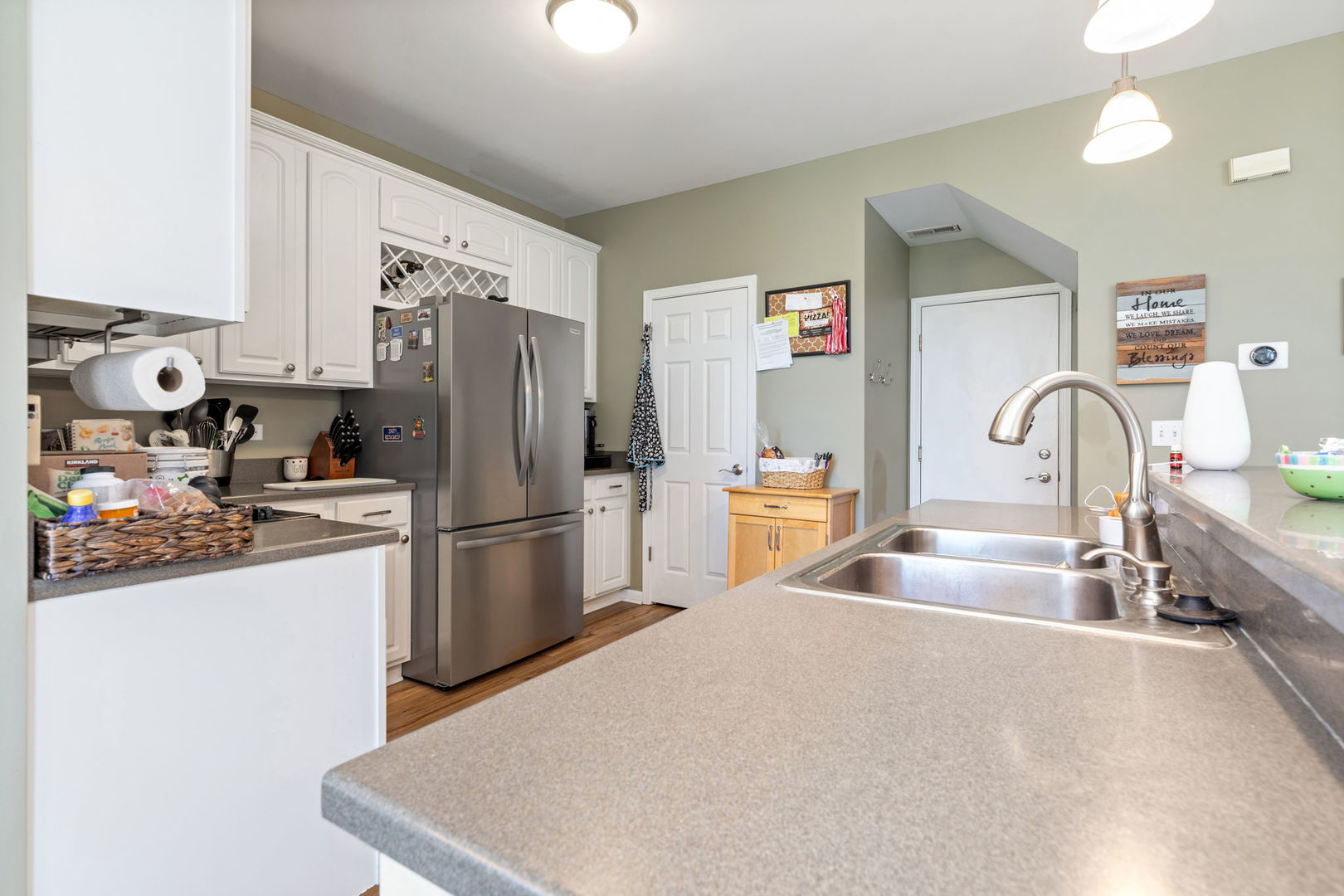 5003 Syracuse Court Plainfield, IL 60586 - Photo 9 of 18 a kitchen with a refrigerator and a sink