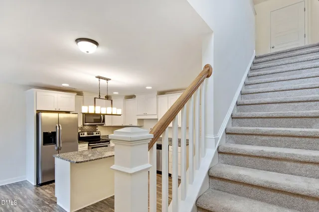 a view of kitchen with cabinets and stainless steel appliances