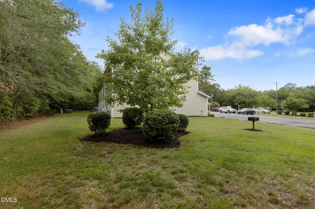 a backyard of a house with lots of green space