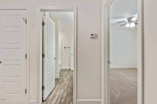 a view of a bathroom from the hallway