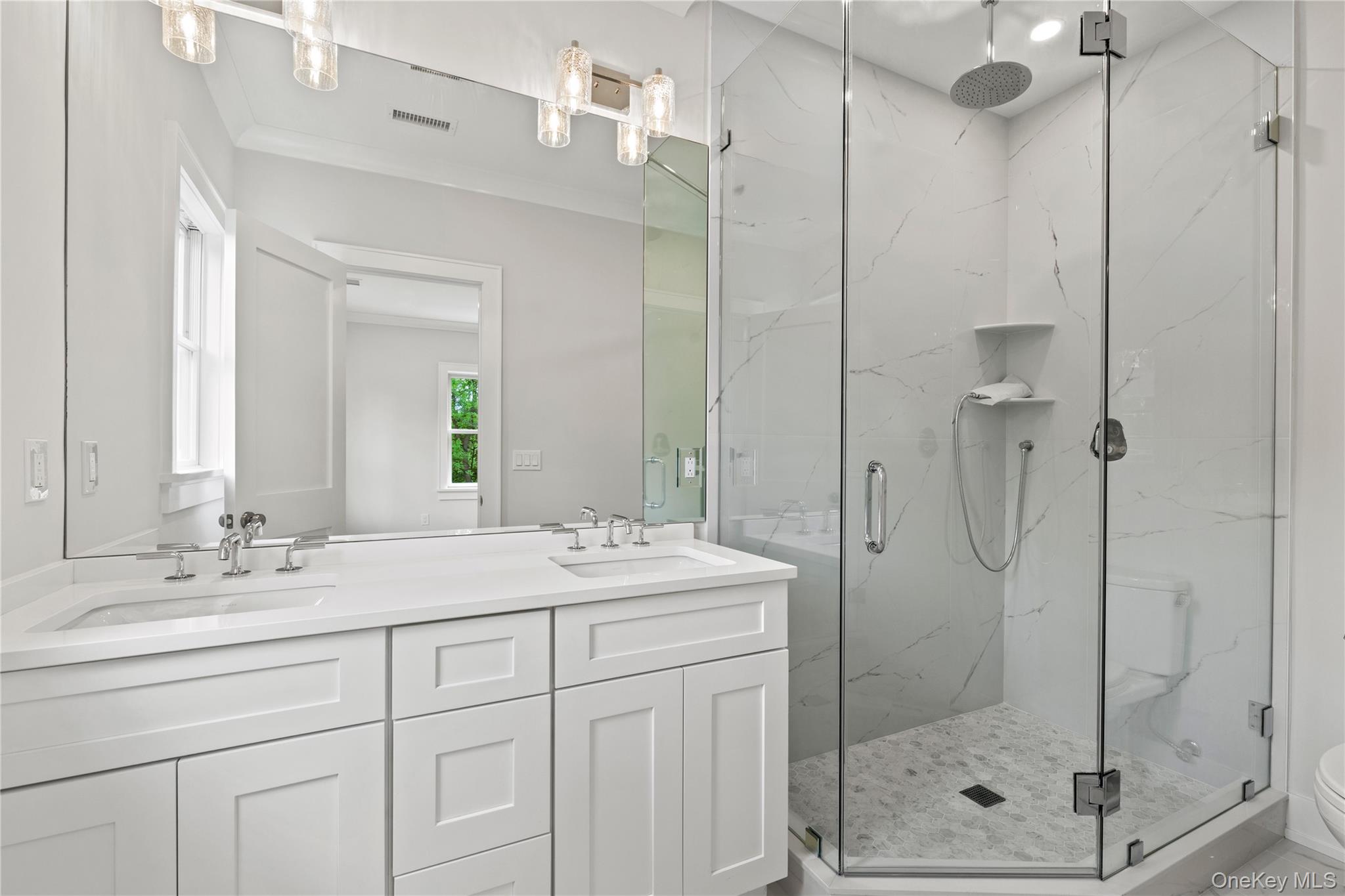 86 B Maple Street Rye, NY 10580 - Photo 11 of 33 a bathroom with a shower sink and mirror