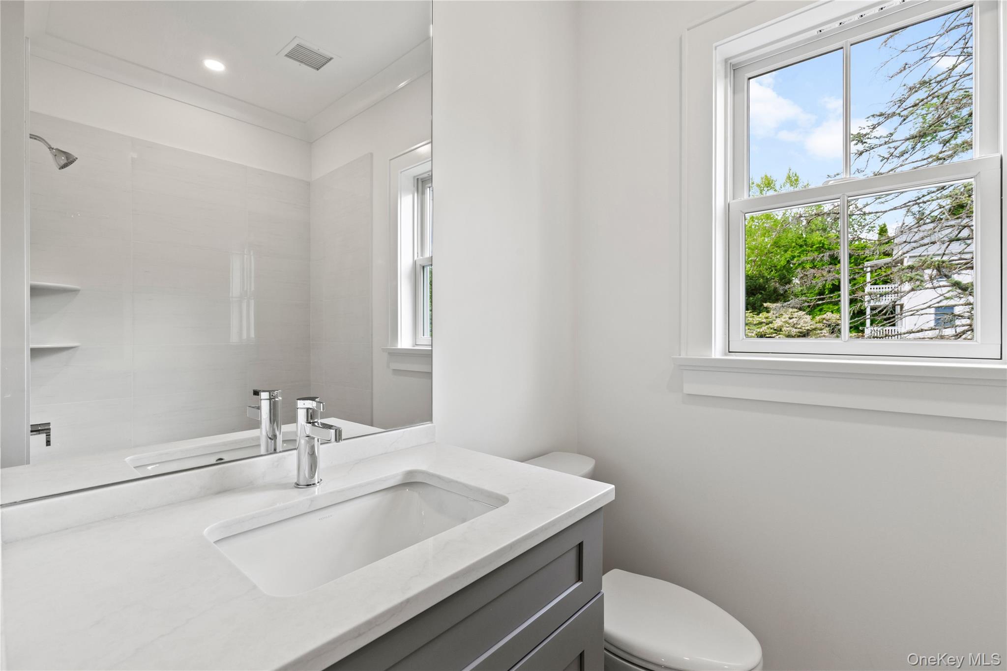 86 B Maple Street Rye, NY 10580 - Photo 14 of 33 a bathroom with a toilet sink and mirror