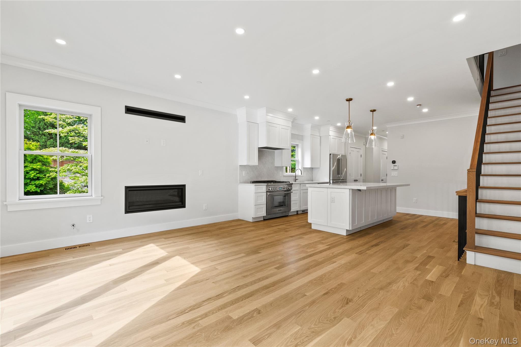86 B Maple Street Rye, NY 10580 - Photo 2 of 33 a view of a kitchen with kitchen island wooden floor and stainless steel appliances