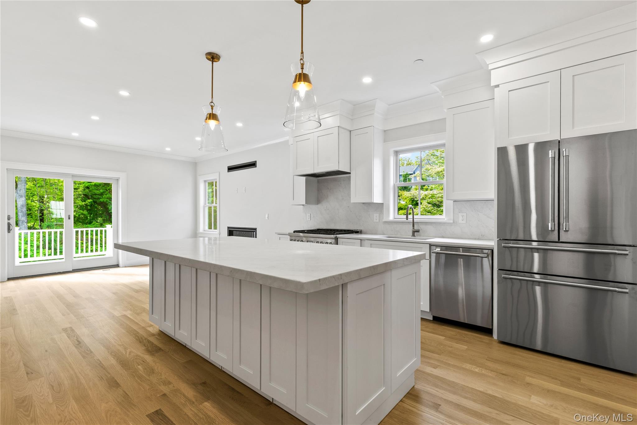 86 B Maple Street Rye, NY 10580 - Photo 6 of 33 a kitchen with stainless steel appliances granite countertop a sink a stove a refrigerator and island with wooden floor