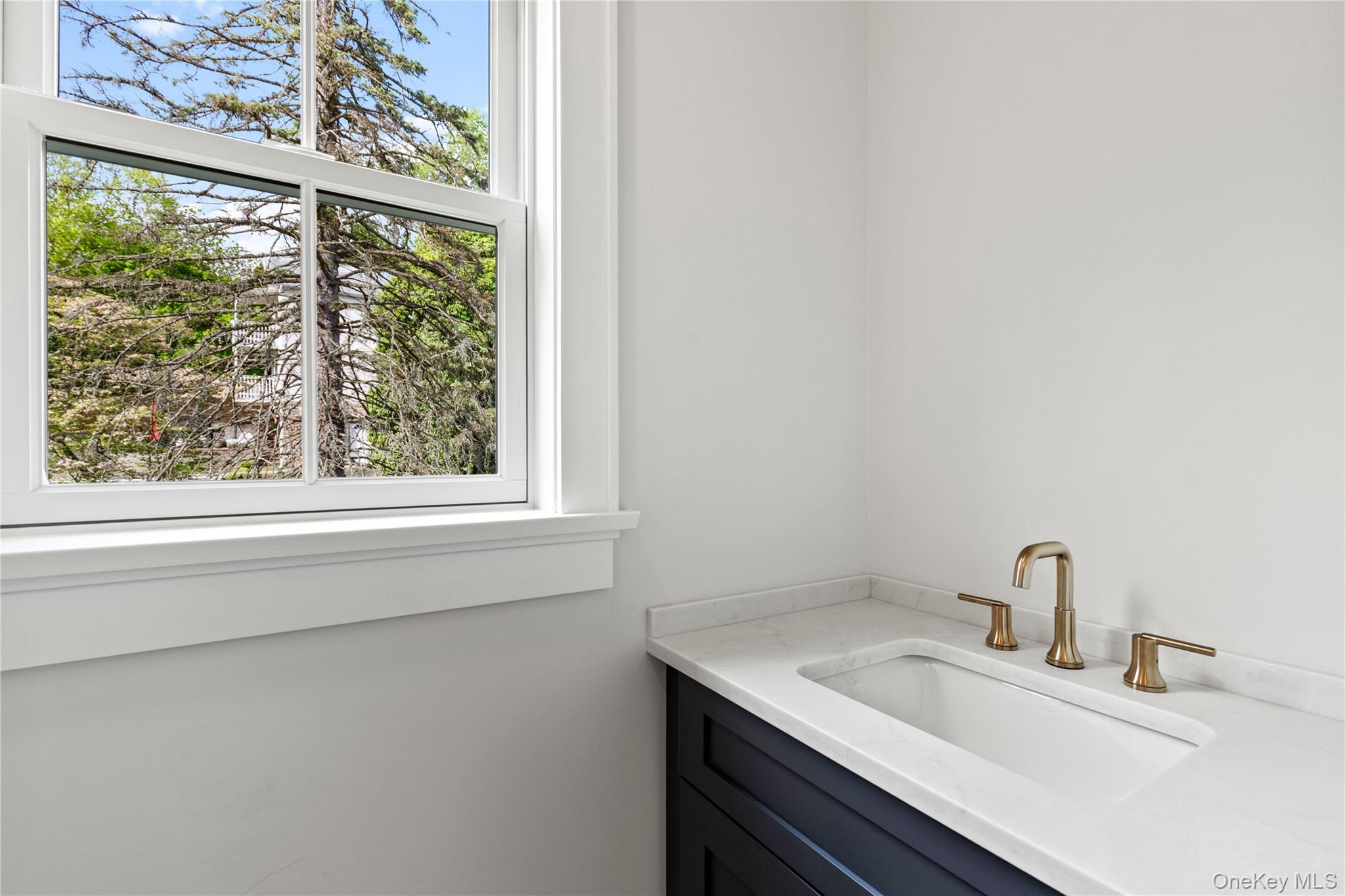 86 B Maple Street Rye, NY 10580 - Photo 8 of 33 a bathroom with a sink and a window