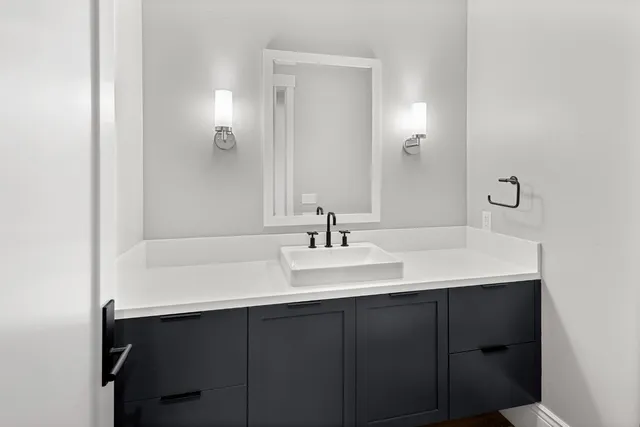 a bathroom with a sink and a mirror