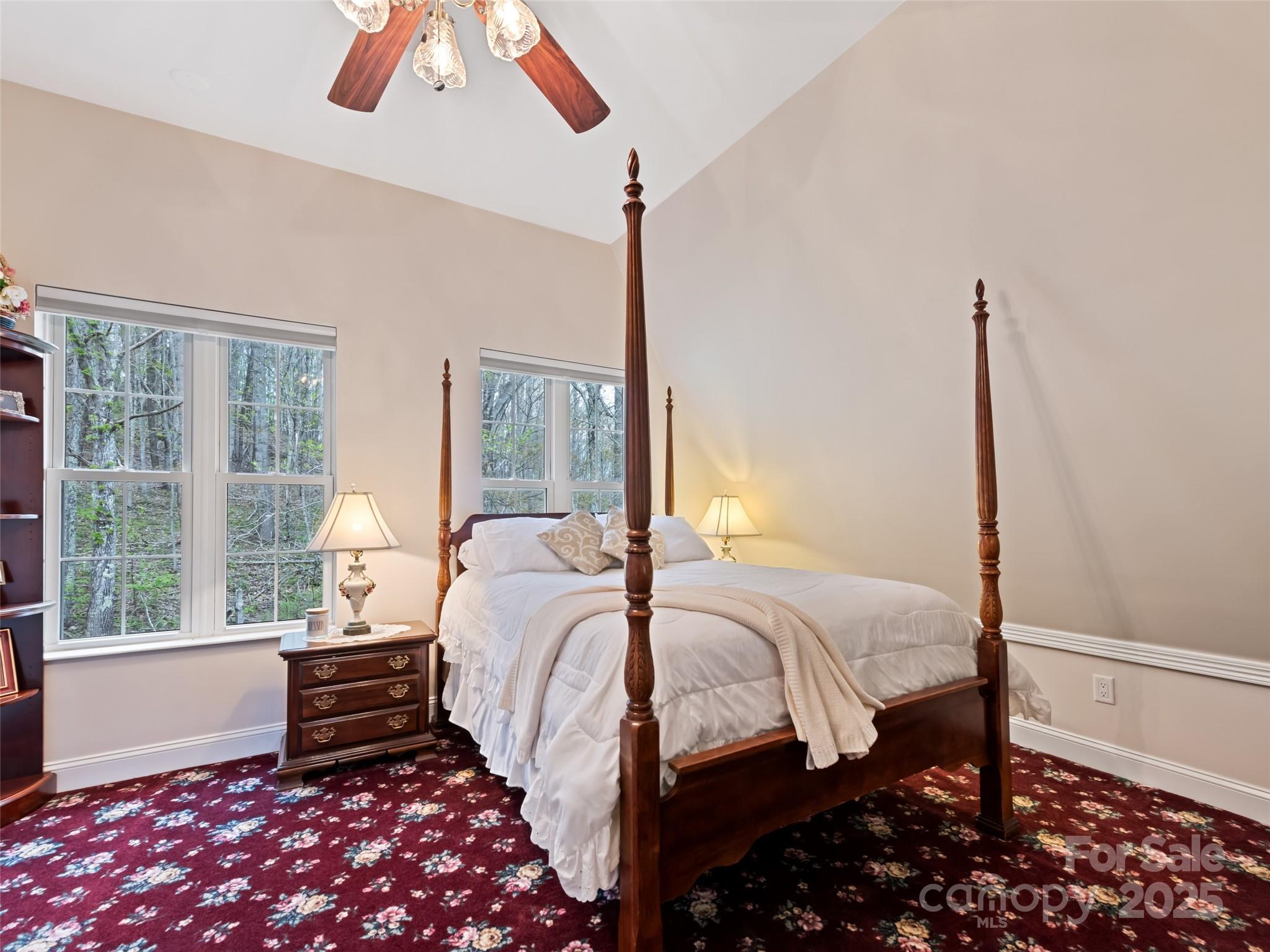 6780 Max Patch Road Clyde, NC 28721 - Photo 14 of 32 a bedroom with a bed next to a window
