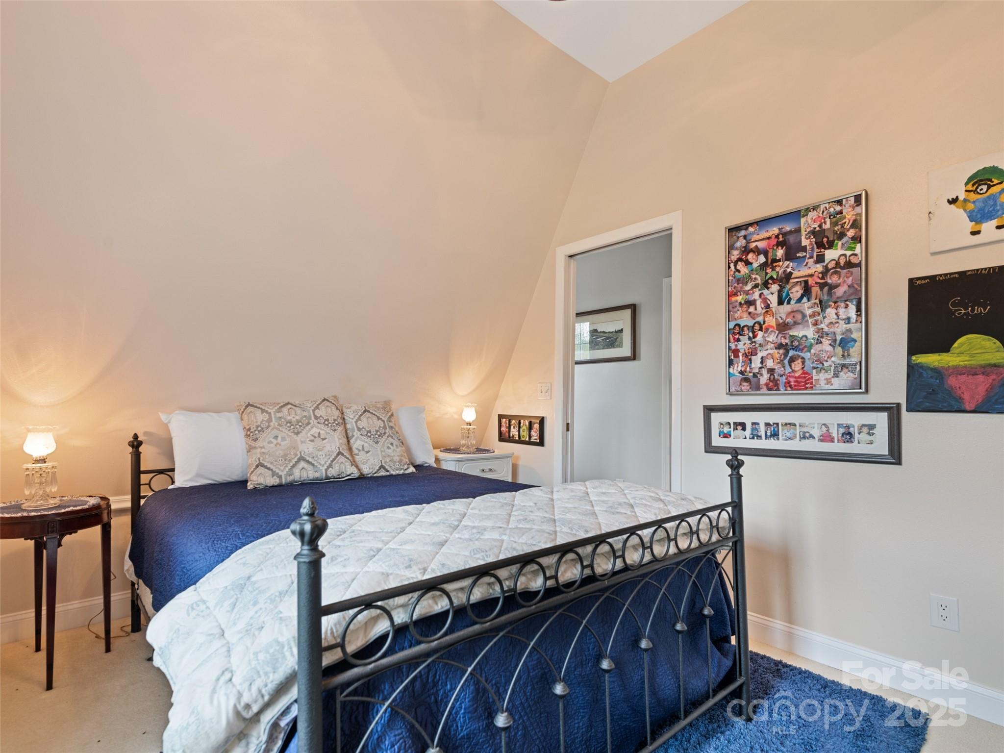 6780 Max Patch Road Clyde, NC 28721 - Photo 15 of 32 a living room with furniture and paintings on the wall