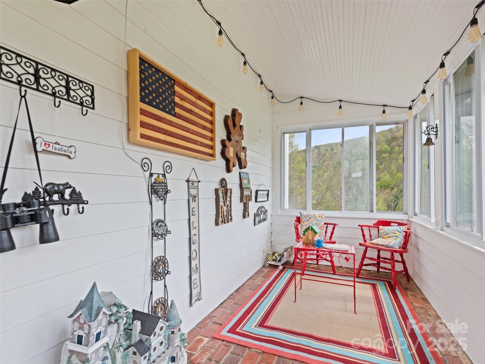 6780 Max Patch Road Clyde, NC 28721 - Photo 21 of 32 a living room with furniture and a window