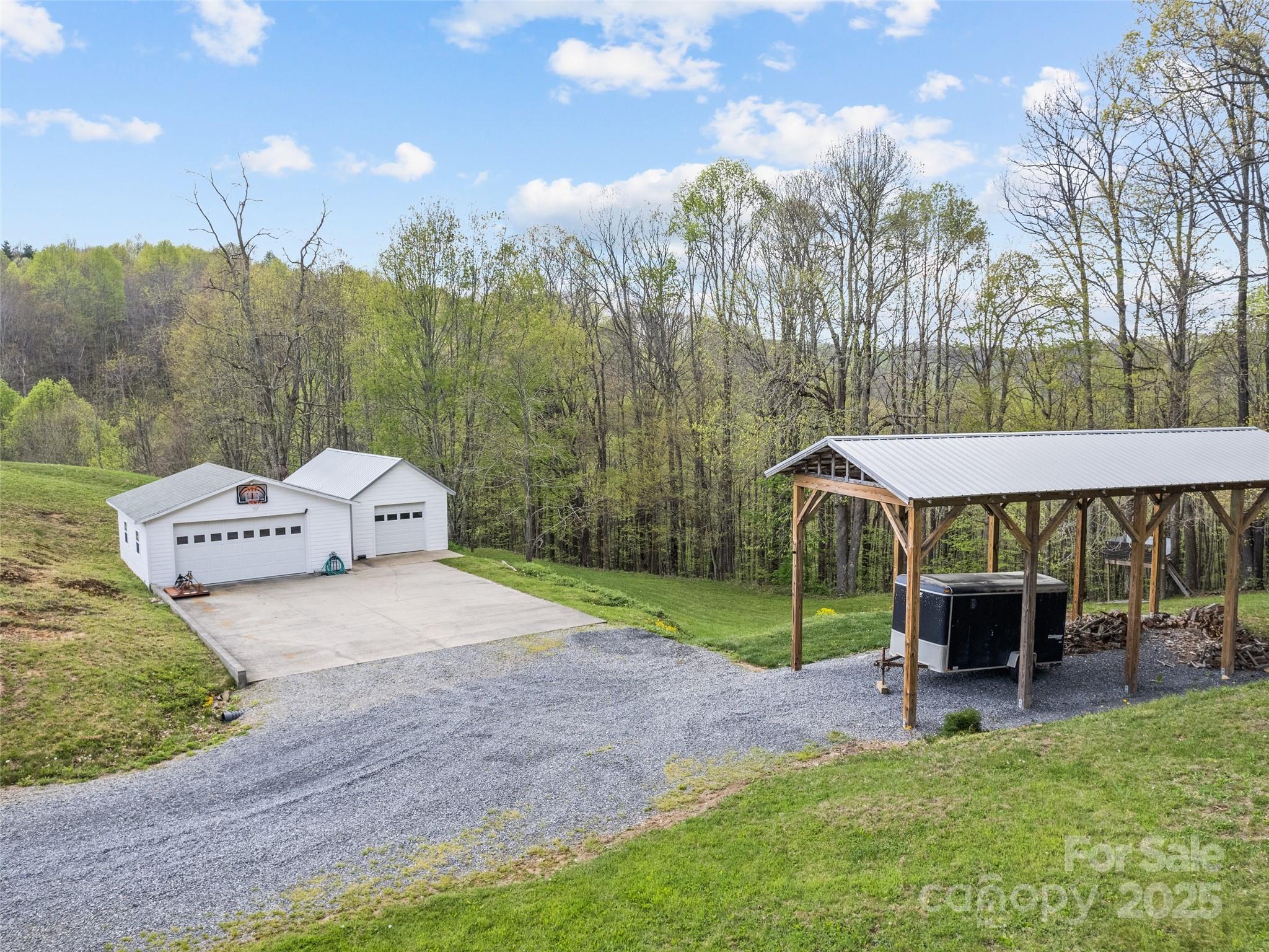 6780 Max Patch Road Clyde, NC 28721 - Photo 24 of 32 a garden view with a seating space
