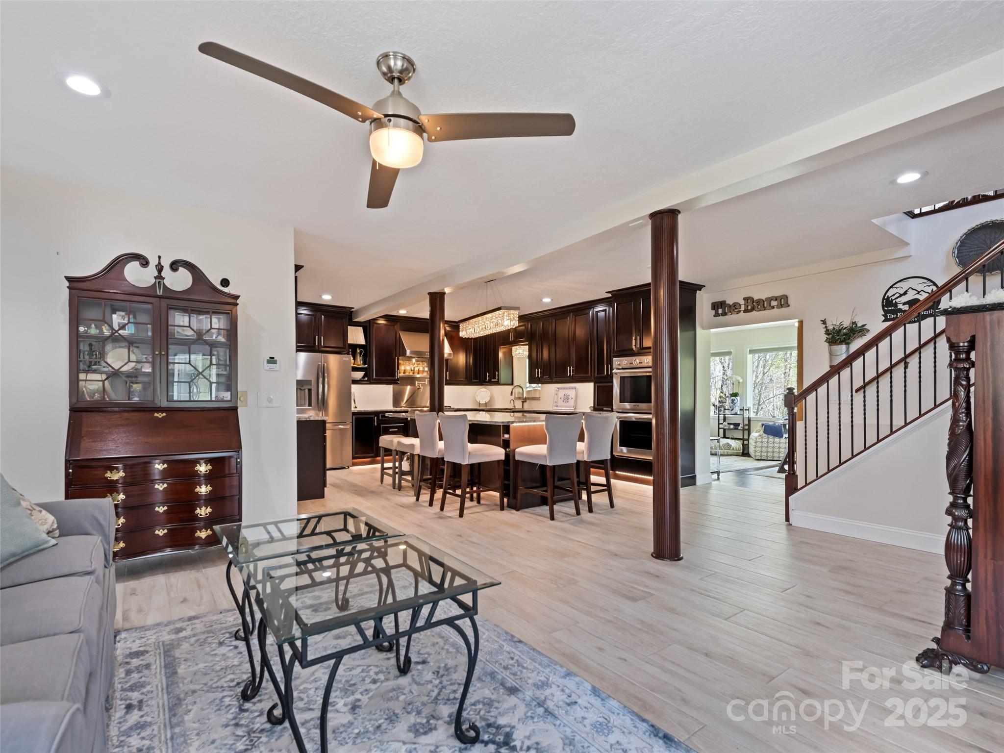 6780 Max Patch Road Clyde, NC 28721 - Photo 3 of 32 a living room with furniture and wooden floor