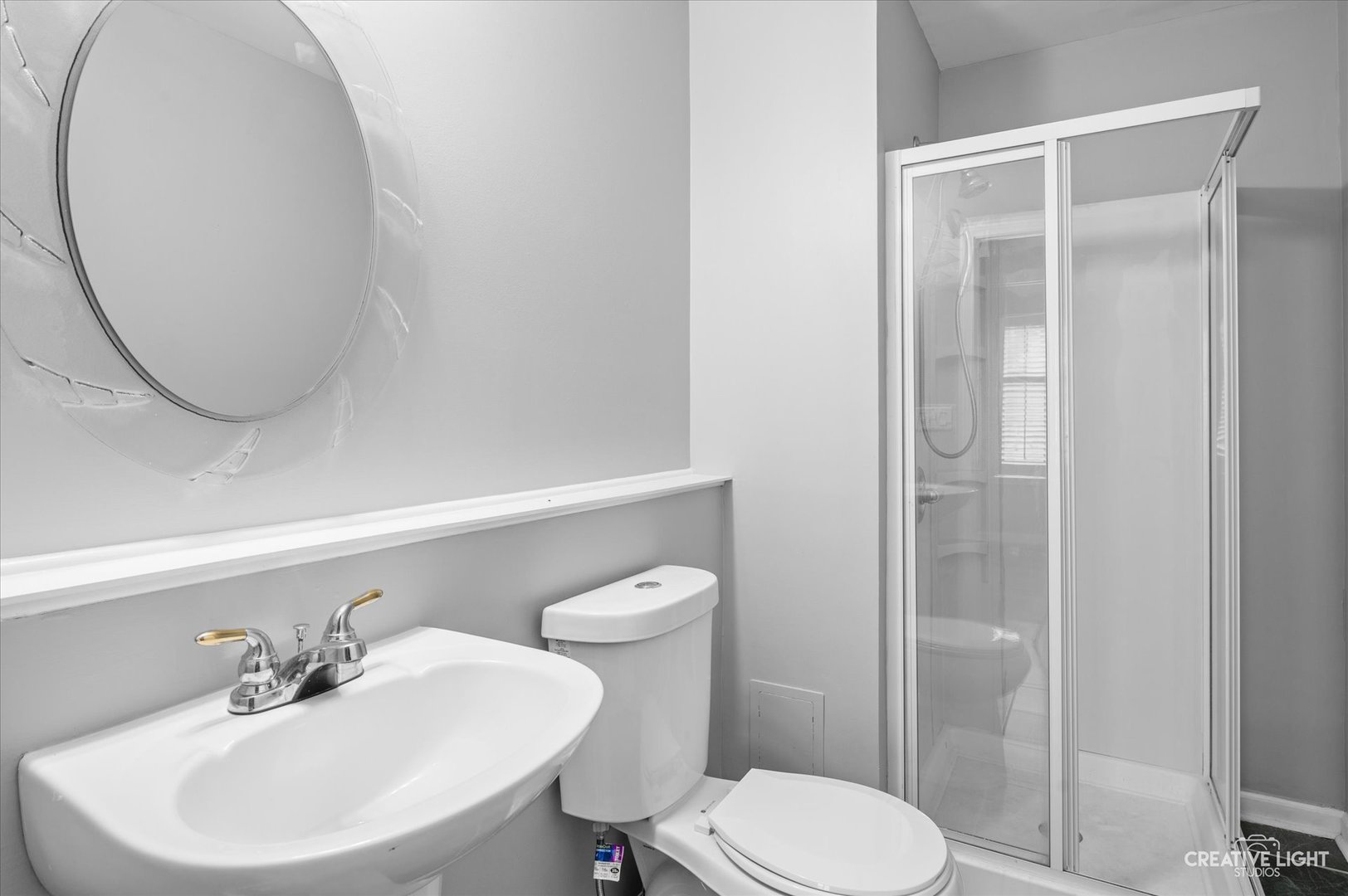 3405 Ravinia Circle, Unit 3405 Aurora, IL 60504 - Photo 16 of 17 a bathroom with a sink a toilet and a mirror