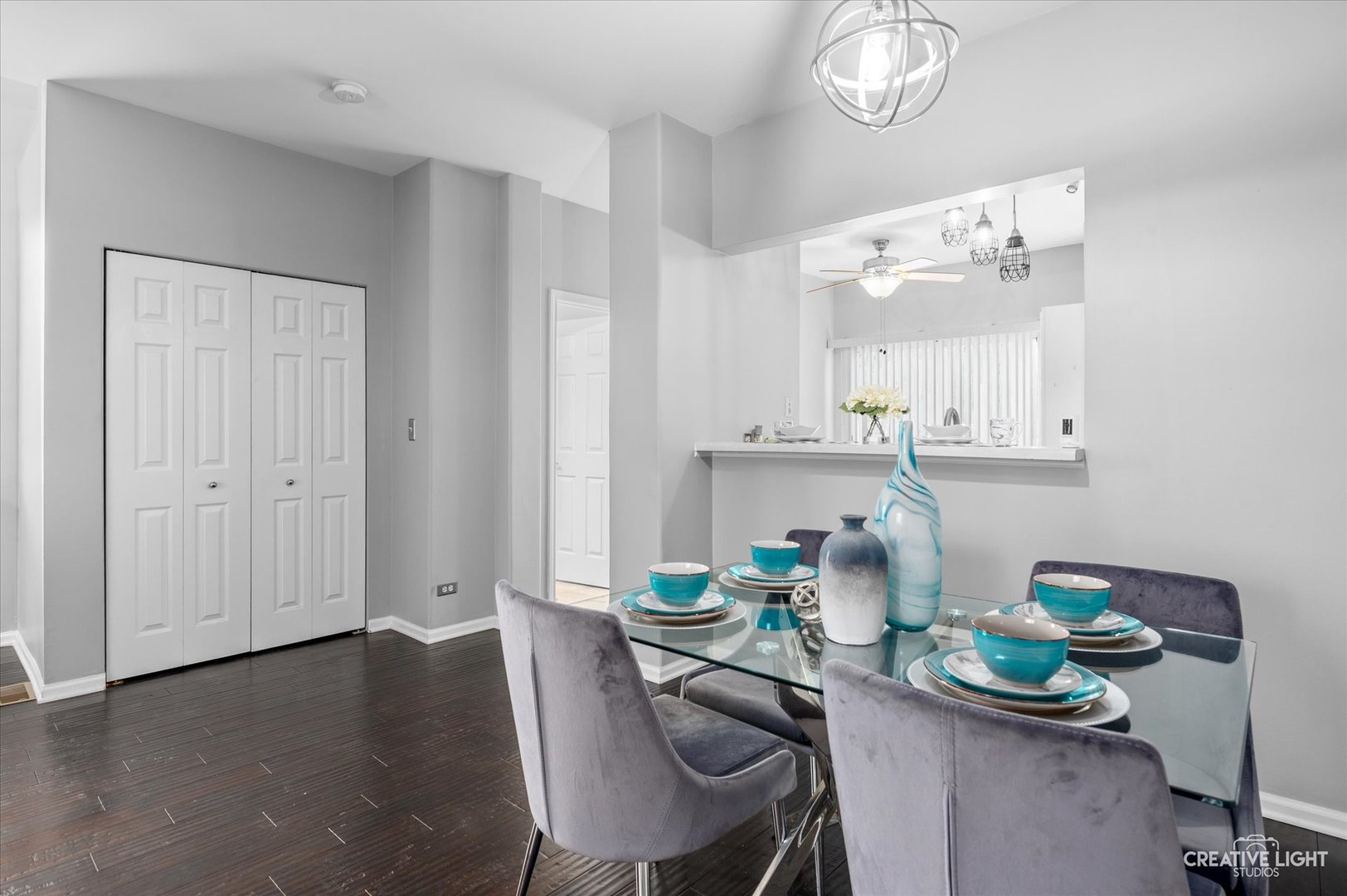3405 Ravinia Circle, Unit 3405 Aurora, IL 60504 - Photo 5 of 17 a dining room with furniture a chandelier and wooden floor
