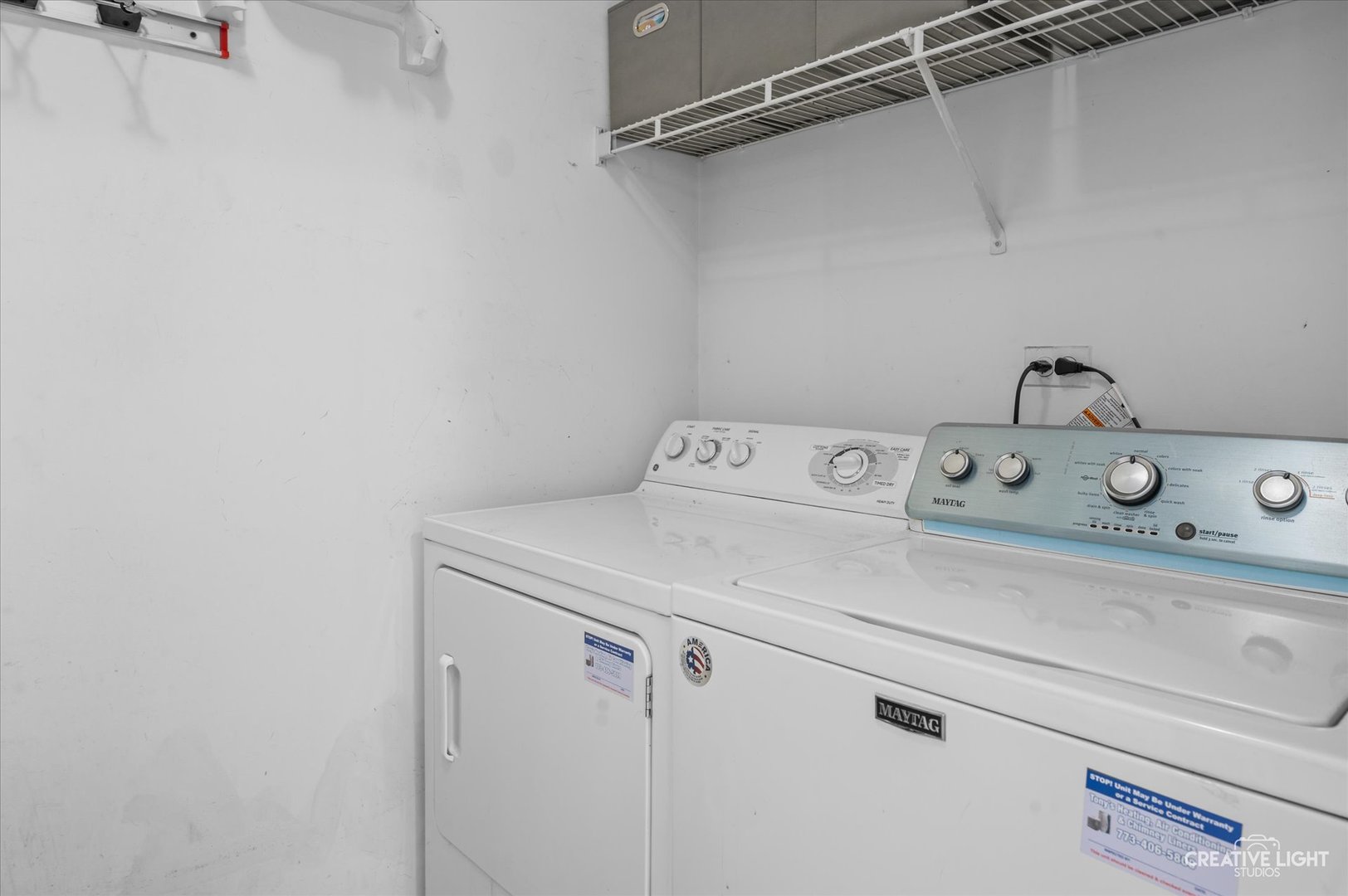 3405 Ravinia Circle, Unit 3405 Aurora, IL 60504 - Photo 9 of 17 a utility room with dryer and washer