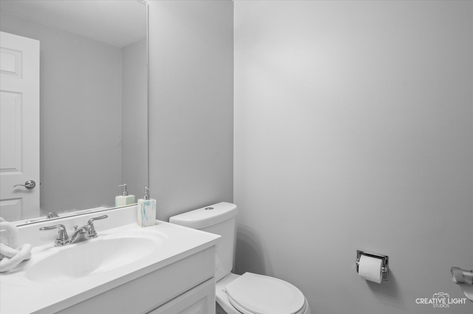 3405 Ravinia Circle, Unit 3405 Aurora, IL 60504 - Photo 10 of 17 a bathroom with a toilet a sink and mirror