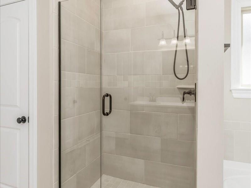 133 Brimestone Loop Benton, LA 71006 - Photo 17 of 32 a bathroom with a glass shower door