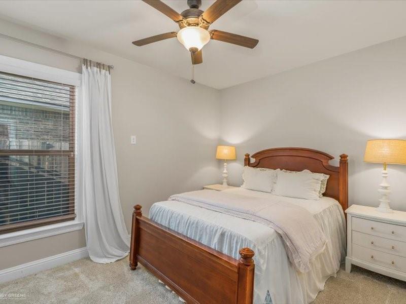 133 Brimestone Loop Benton, LA 71006 - Photo 18 of 32 a bedroom with a bed and a chandelier fan