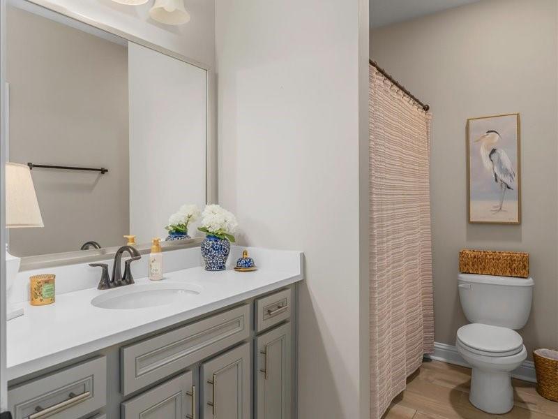 133 Brimestone Loop Benton, LA 71006 - Photo 19 of 32 a bathroom with a toilet sink and mirror