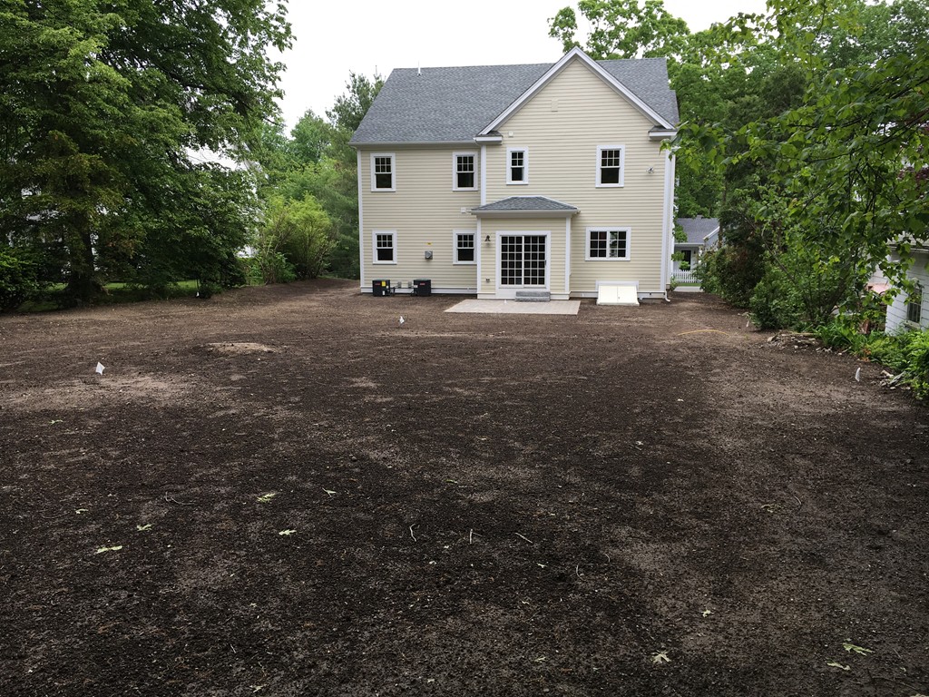 37 Fairview Road Needham, MA 02492 - Photo 4 of 8 a view of a white house with a yard