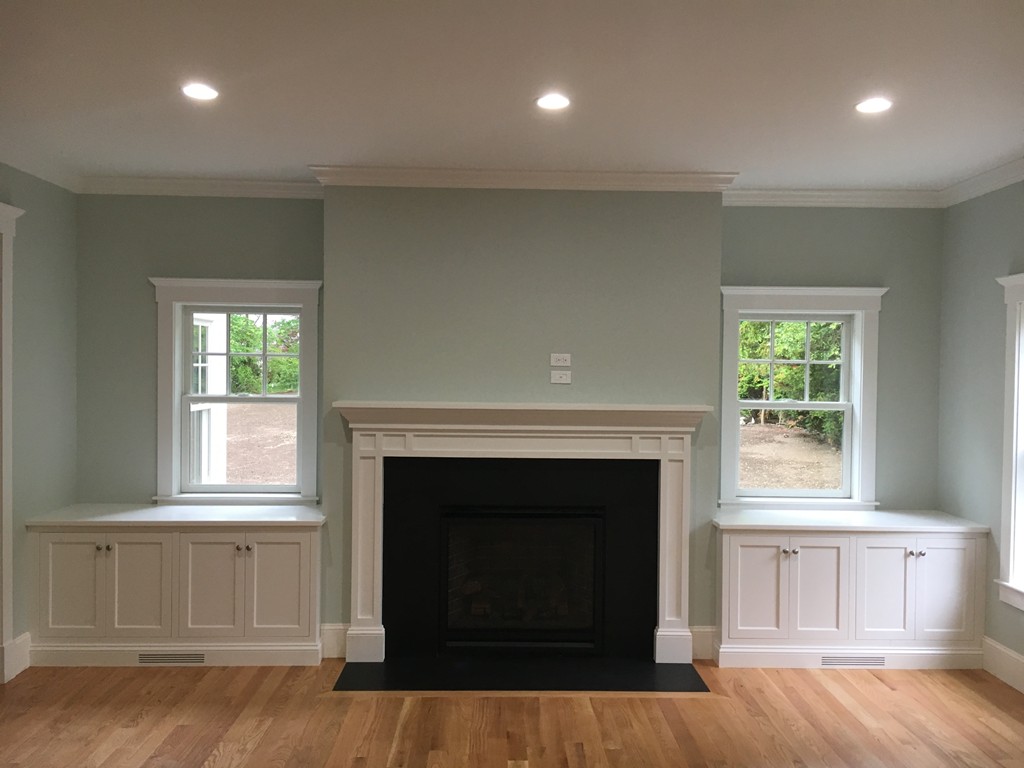 37 Fairview Road Needham, MA 02492 - Photo 5 of 8 a living room with a fireplace and wooden floor