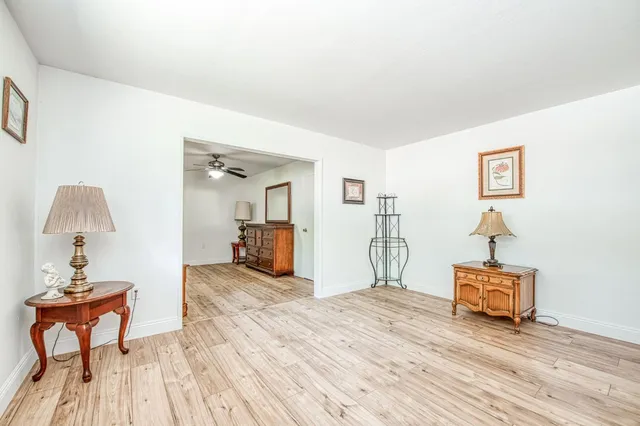a room with furniture and wooden floor