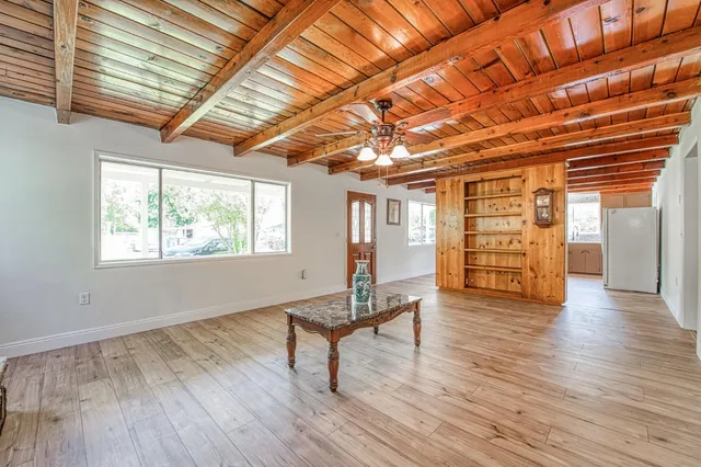 a view of a livingroom with wooden floor