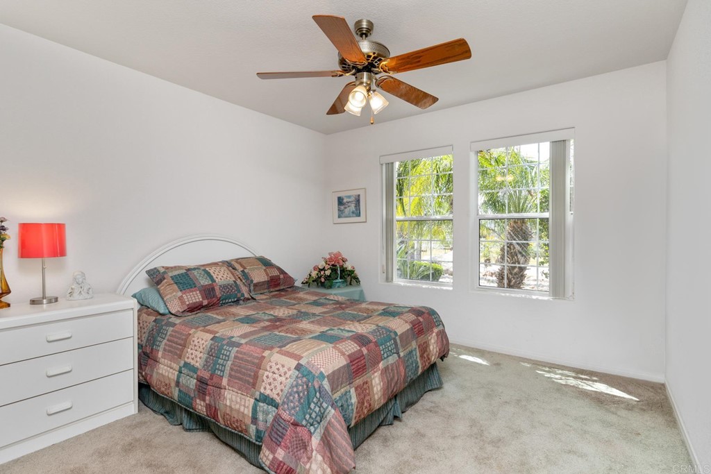 575 Rancho Trail Ramona, CA 92065 - Photo 11 of 47 a bedroom with a bed and window