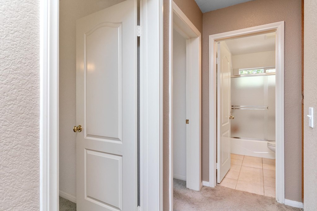 575 Rancho Trail Ramona, CA 92065 - Photo 12 of 47 a view of a bathroom from a hallway