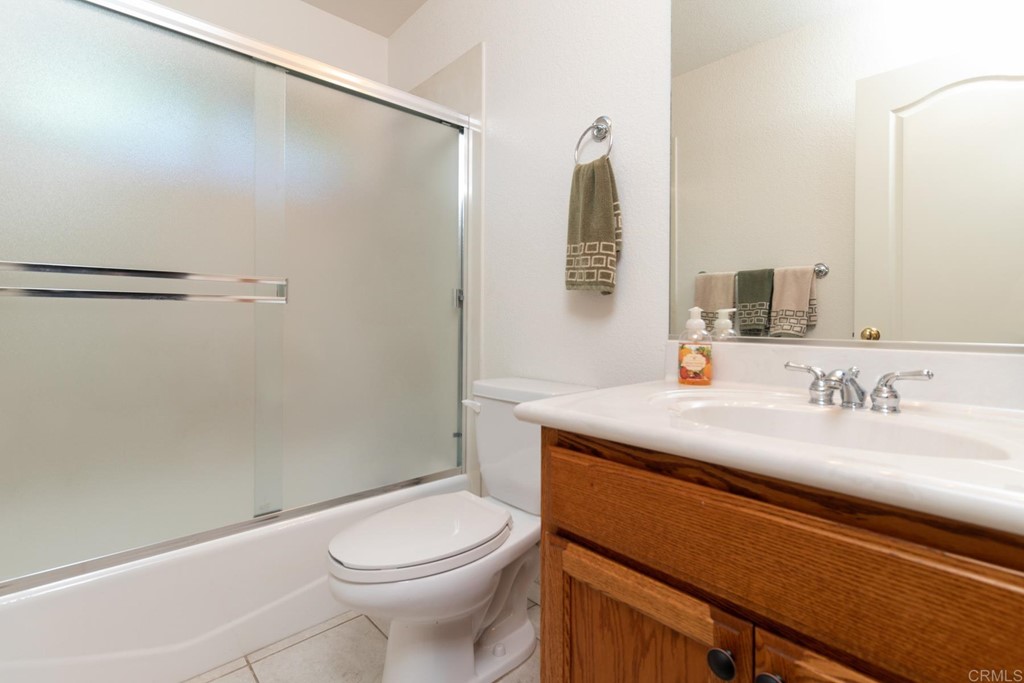 575 Rancho Trail Ramona, CA 92065 - Photo 13 of 47 a bathroom with a sink a toilet and shower