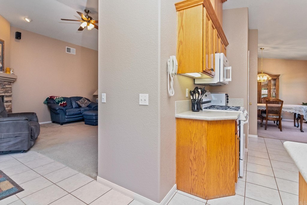 575 Rancho Trail Ramona, CA 92065 - Photo 23 of 47 a en suite bathroom with a tub sink and mirror