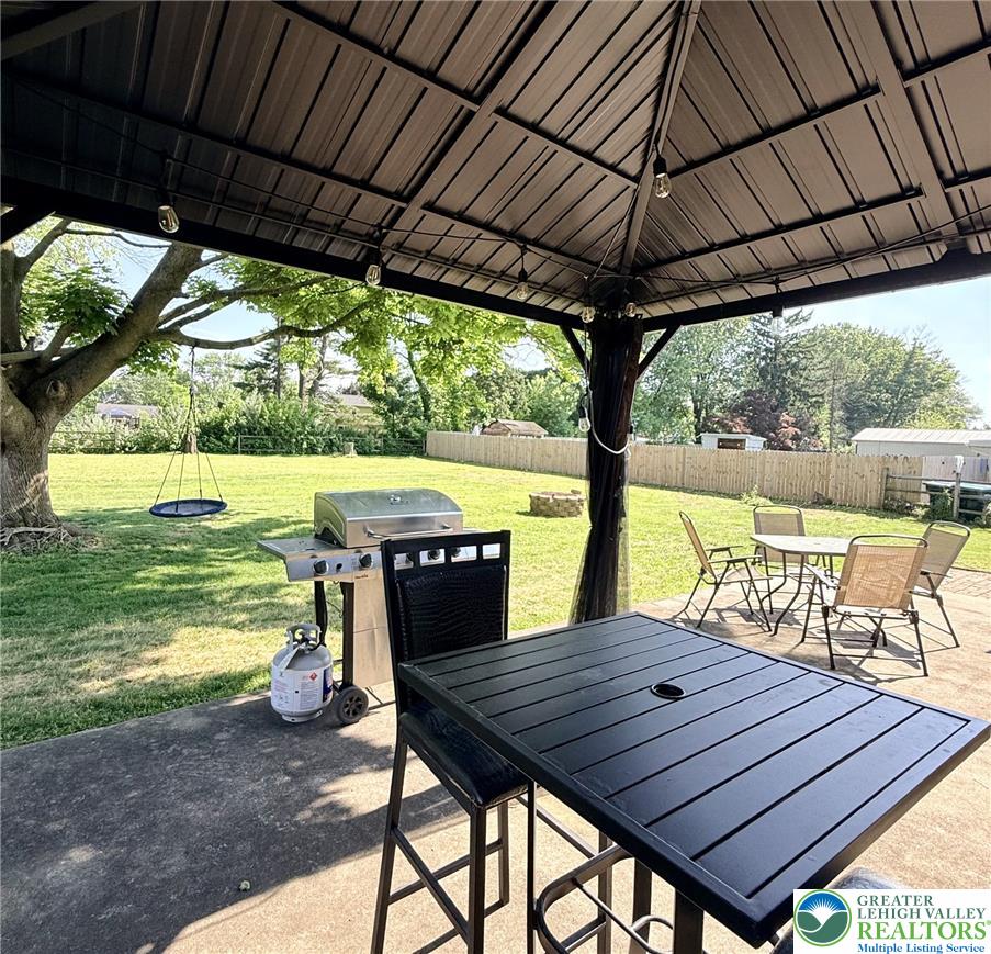 1275 Macada Road Bethlehem, PA 18017 - Photo 11 of 87 A spacious backyard with mature trees and a fenced perimeter offers a perfect setting for outdoor enjoyment.