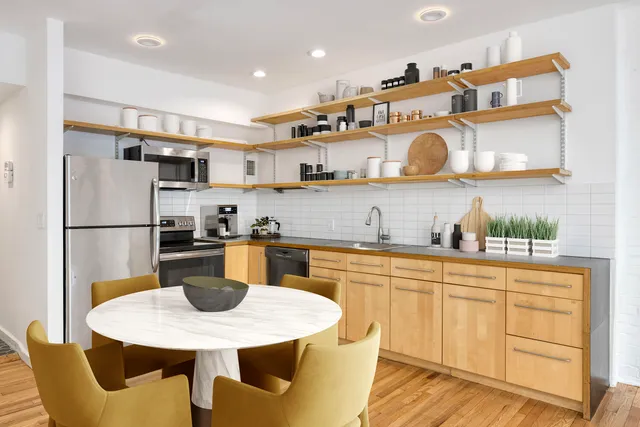 a bathroom with a granite countertop toilet a sink and bathtub