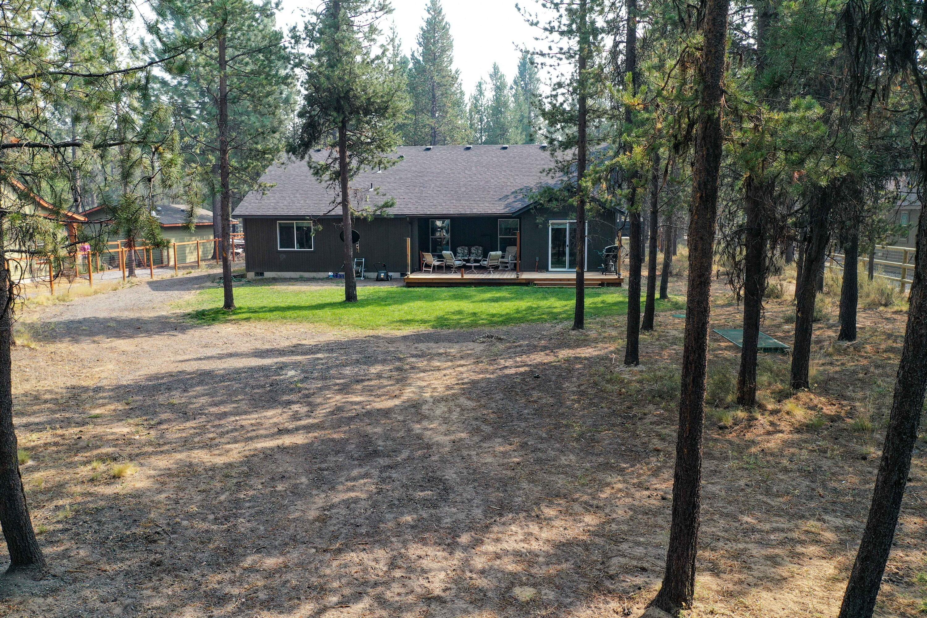 17160 Elsinore Road Bend, OR 97707 - Photo 32 of 47 a front view of a house with garden