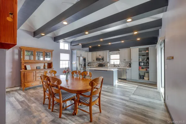 a dining room with furniture and window