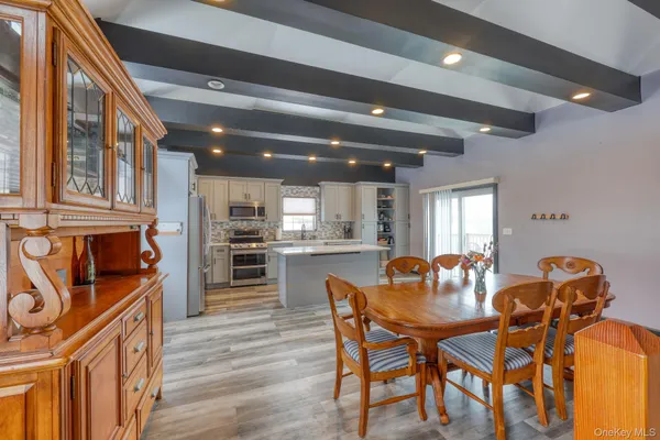 a dining room with furniture and window