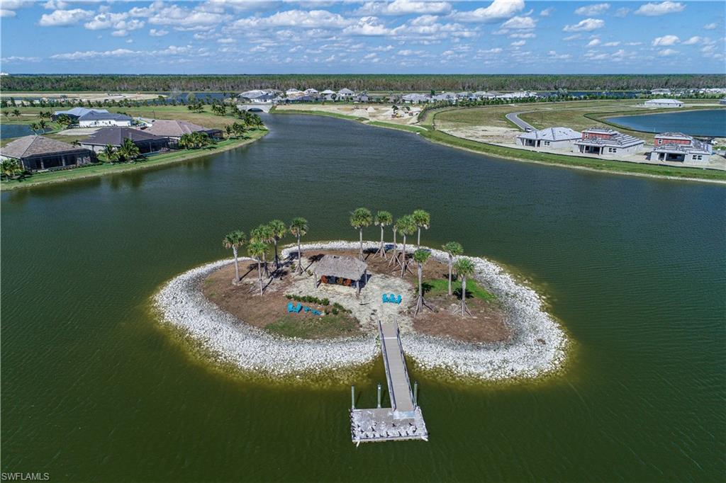 14559 Edgewater Circle Naples, FL 34114 - Photo 38 of 49 an aerial view of a house with a lake view