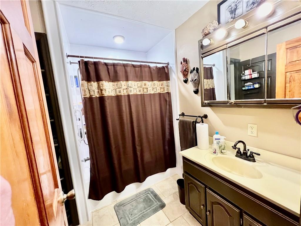 114 Church Road Rural Valley, PA 16249 - Photo 36 of 50 a bathroom with sink a mirror and vanity