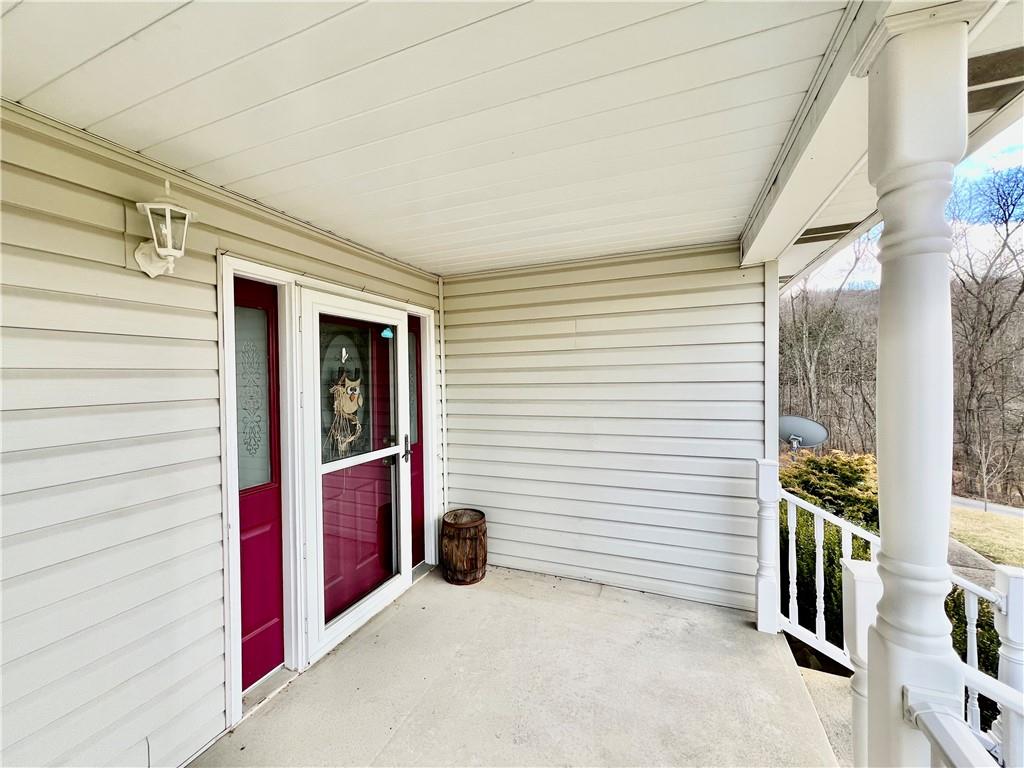 114 Church Road Rural Valley, PA 16249 - Photo 8 of 50 a view of a porch with furniture and front door